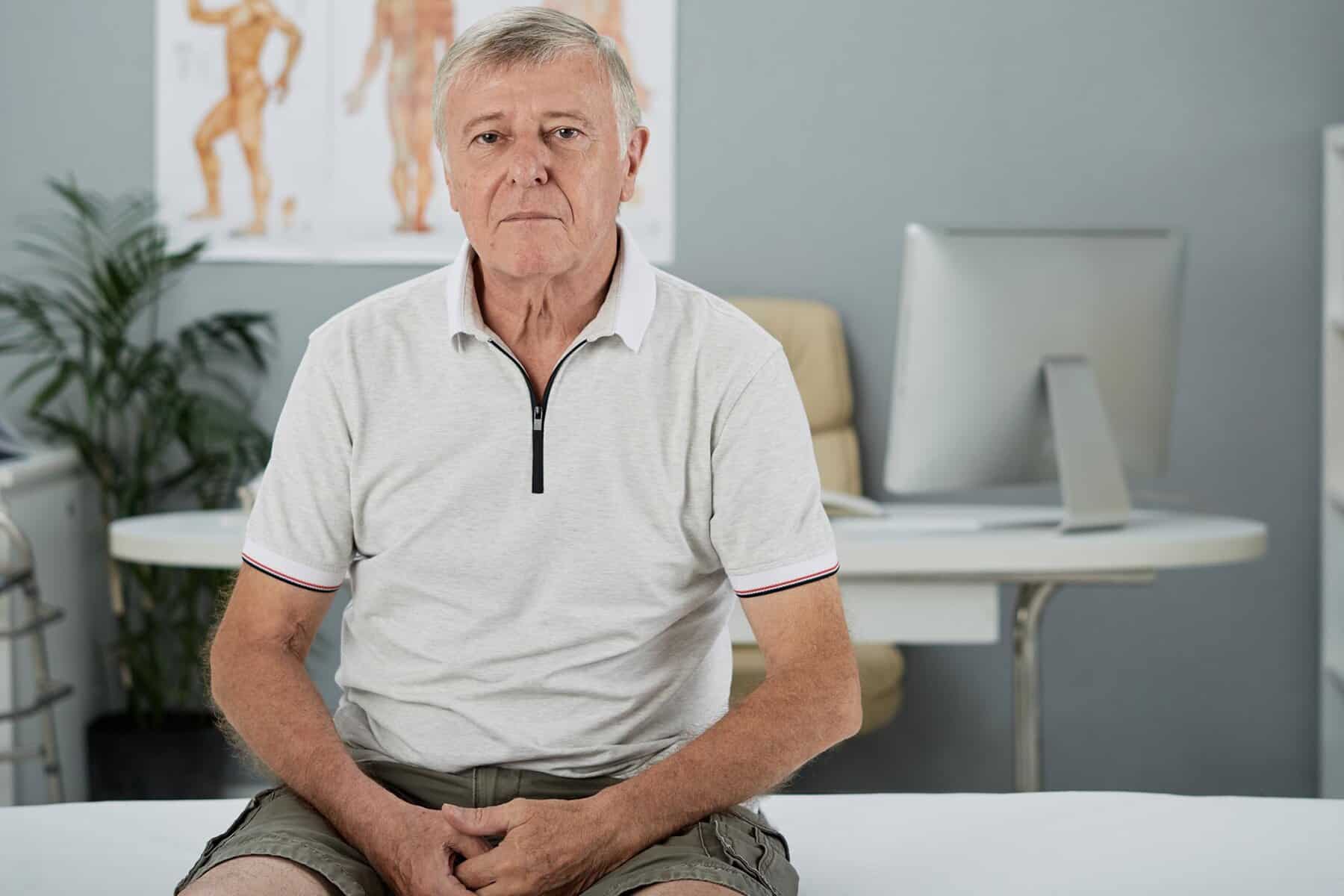 man sitting in doctor room